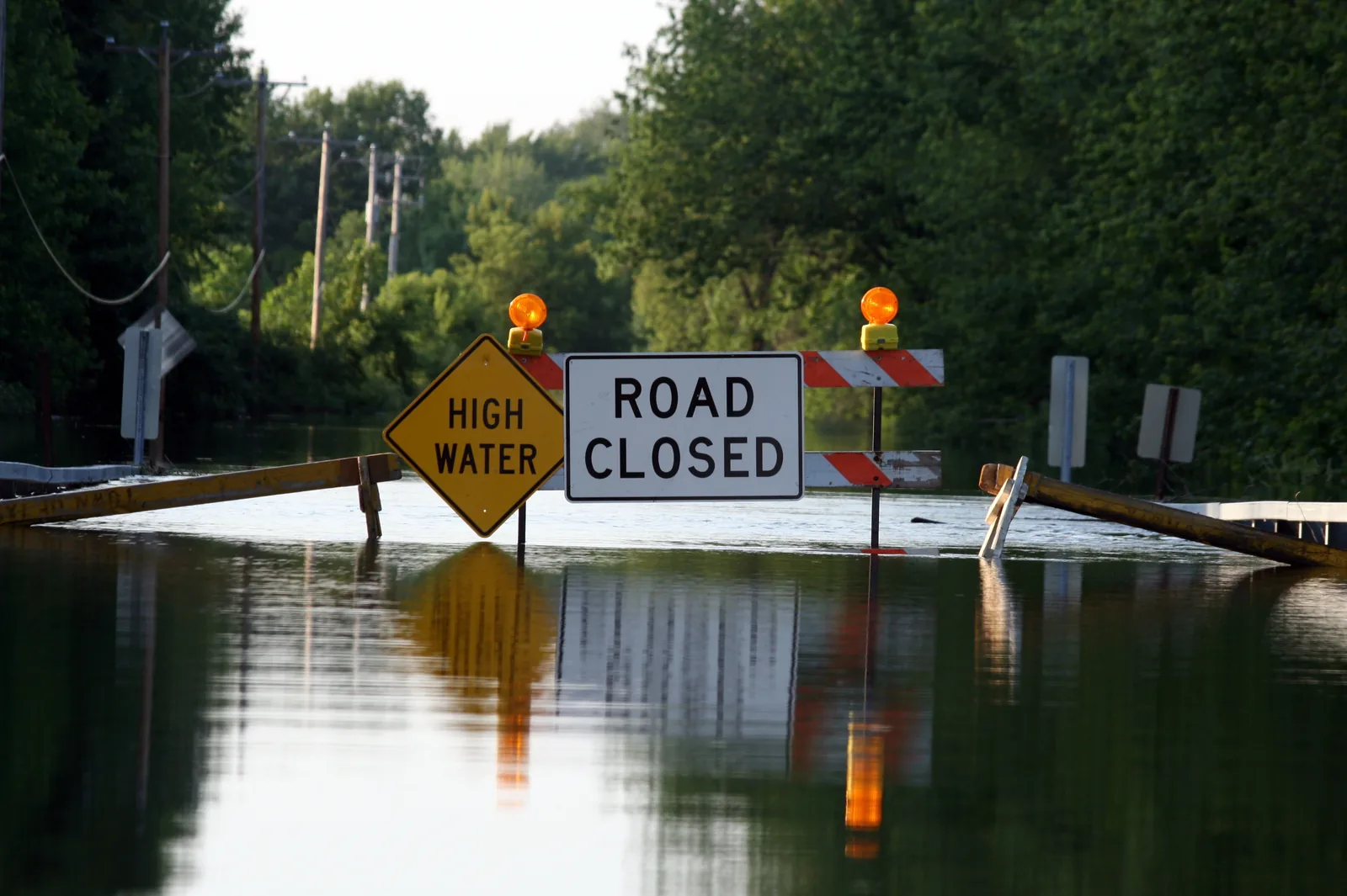 Flooded road during wet-weather conditions affecting sewer systems